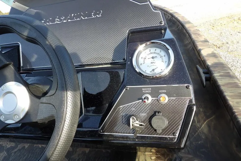 Slide: The Image of 2026 Crestliner XF 189 dashboard with steering wheel and RPM gauge. - 24