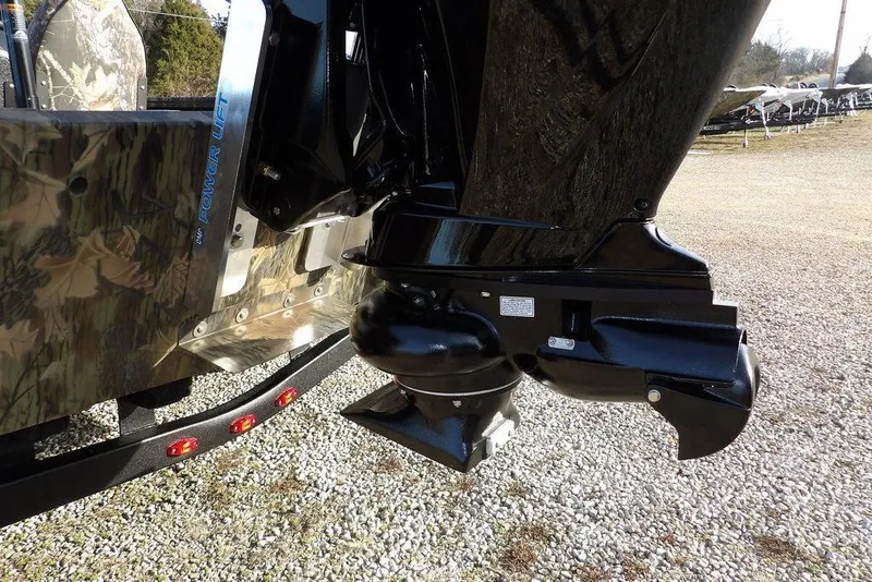 Slide: The Image of 2026 Crestliner XF 189 boat motor with camouflage design and power lift feature. - 29