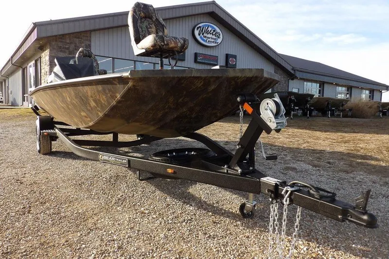 Slide: The Image of 2026 Crestliner XF 189 boat on trailer outside marine center. - 34