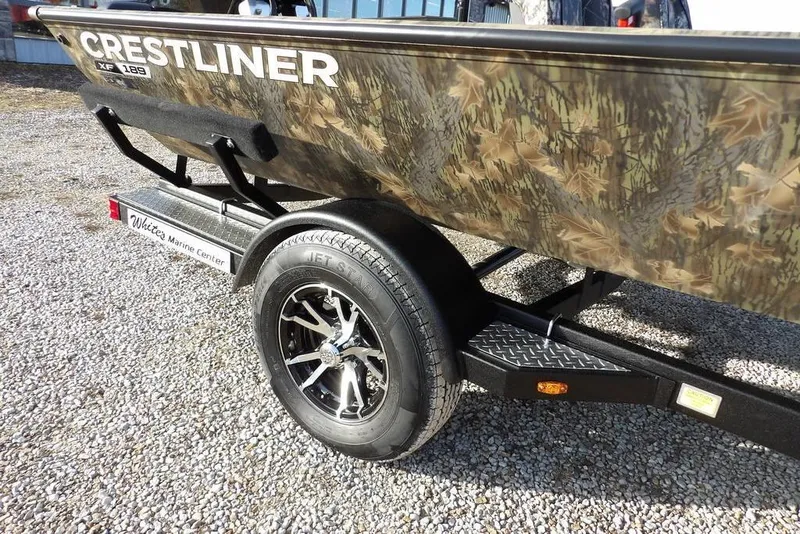 Slide: The Image of 2026 Crestliner XF 189 boat with camouflage design on a trailer. - 35