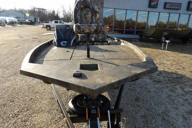 Slide: The Image of 2026 Crestliner XF 189 boat with camouflage seating, displayed outdoors. - 4