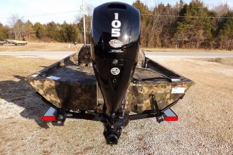 Slide: The Image of 2026 Crestliner XF 189 boat with camo design and powerful outboard motor. - 7