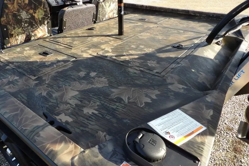 Slide: The Image of 2026 Crestliner XF 189 boat with camouflage deck and storage compartments. - 9