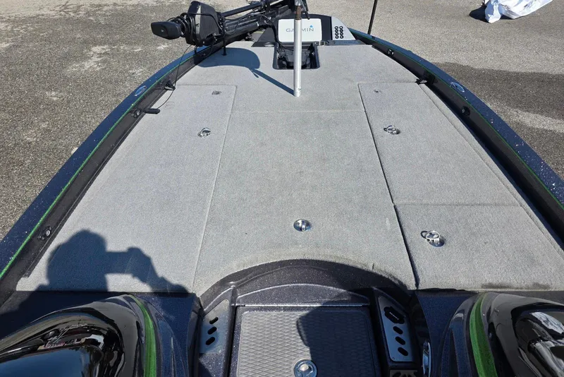 Slide: The Image of 2022 Caymas CX 21 boat deck with Garmin equipment and carpeted surface. - 10