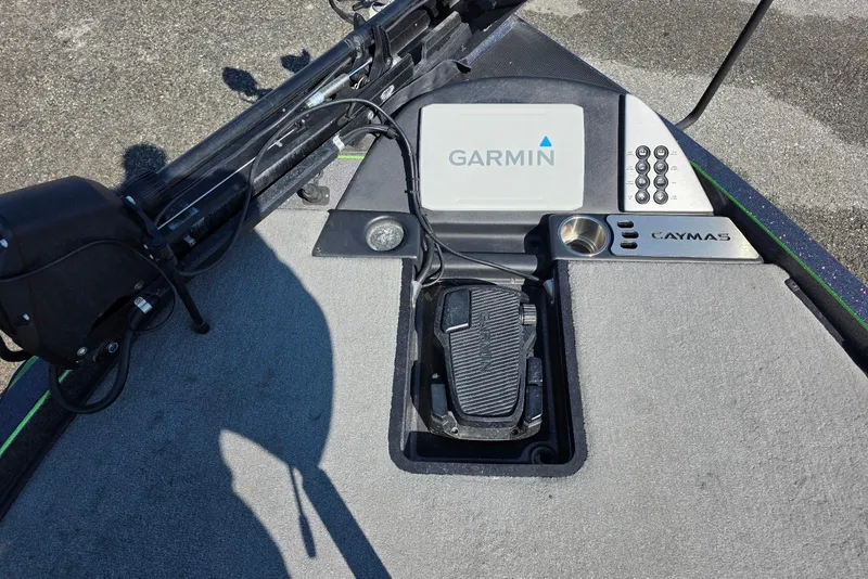 Slide: The Image of 2022 Caymas CX 21 boat deck with Garmin electronics and foot pedal controls. - 12