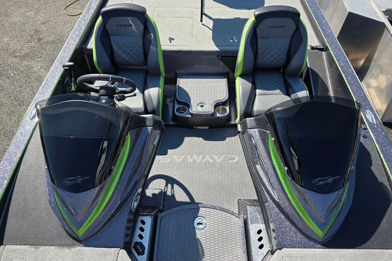 Slide: The Image of 2022 Caymas CX 21 boat interior with dual seats and steering console. - 15