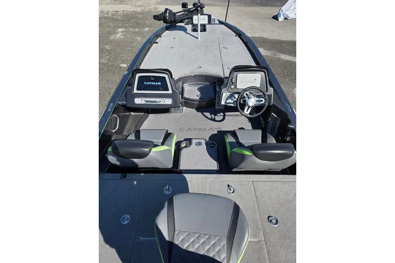Slide: The Image of 2022 Caymas CX 21 boat interior with steering wheel and seating. - 9