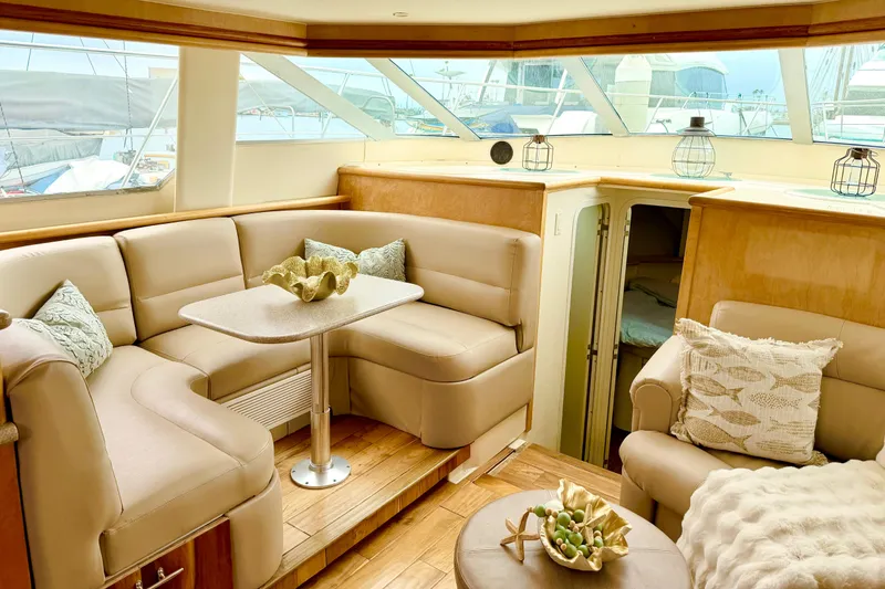 Slide: The Image of Luxurious interior of a 1996 Carver 500 Cockpit Motor Yacht with plush seating and decor. - 12