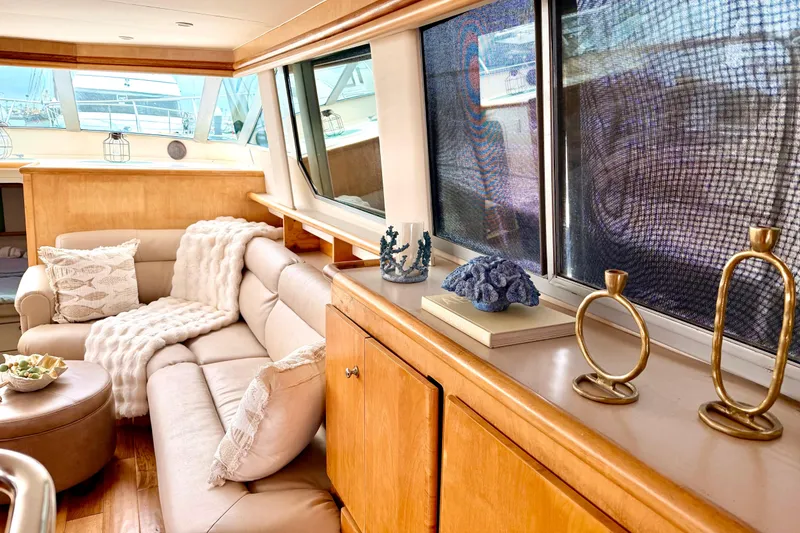 Slide: The Image of Luxurious interior of a 1996 Carver 500 Cockpit Motor Yacht with elegant decor and comfortable seating. - 14