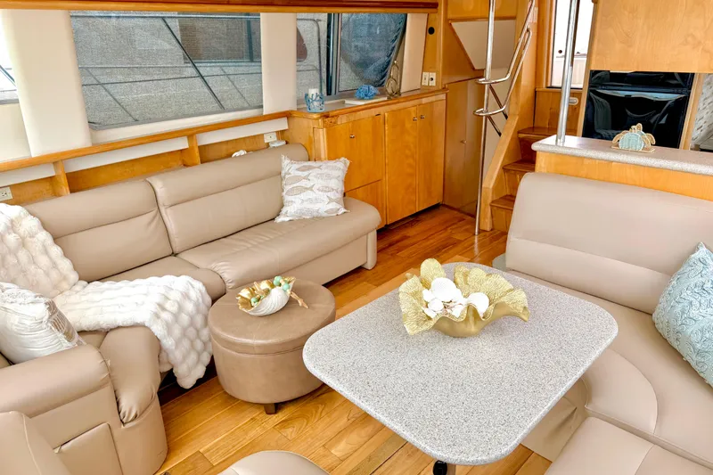Slide: The Image of Luxurious interior of 1996 Carver 500 Cockpit Motor Yacht with elegant seating and decor. - 16