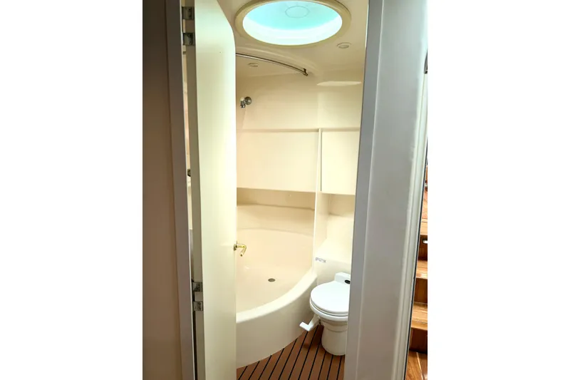 Slide: The Image of Bathroom interior of 1996 Carver 500 Cockpit Motor Yacht with shower and toilet. - 31