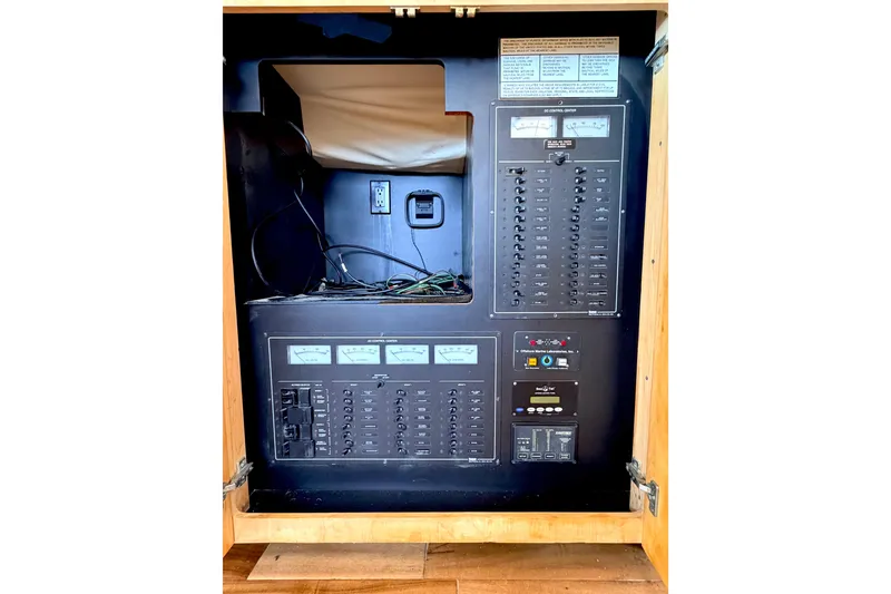 Slide: The Image of Electrical panel of 1996 Carver 500 Cockpit Motor Yacht with gauges and switches. - 33