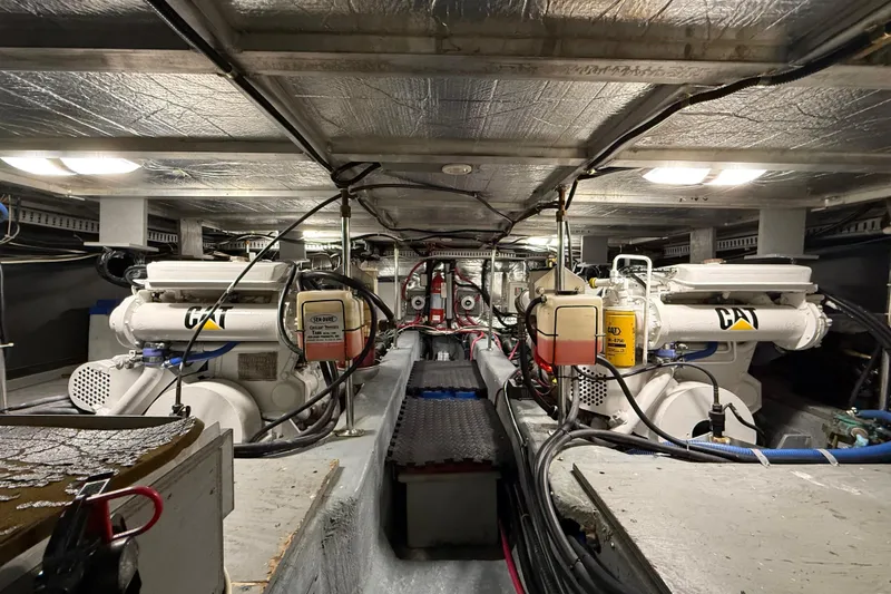 Slide: The Image of Engine room of 1996 Carver 500 Cockpit Motor Yacht with CAT engines and wiring. - 34