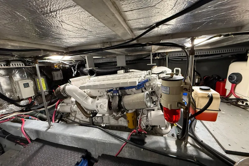 Slide: The Image of Engine room of a 1996 Carver 500 Cockpit Motor Yacht, showcasing mechanical components. - 35