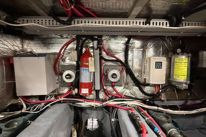 Slide: The Image of Engine room wiring and equipment in a 1996 Carver 500 Cockpit Motor Yacht. - 39