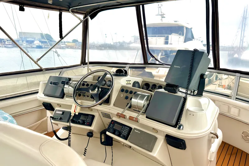 Slide: The Image of Interior view of 1996 Carver 500 Cockpit Motor Yacht helm with navigation equipment. - 5