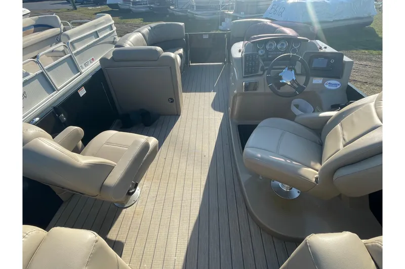 Slide: The Image of 2019 Starcraft SLS 3 boat interior with beige seating and modern dashboard. - 11