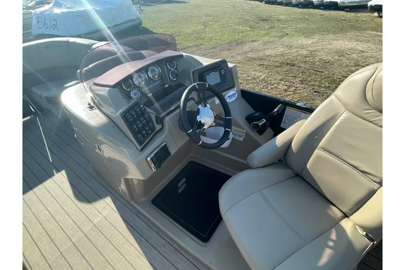Slide: The Image of 2019 Starcraft SLS 3 boat interior with steering wheel and control panel. - 13