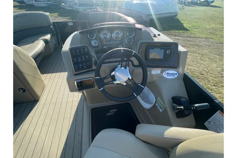 Slide: The Image of 2019 Starcraft SLS 3 boat dashboard with steering wheel and control panel. - 14