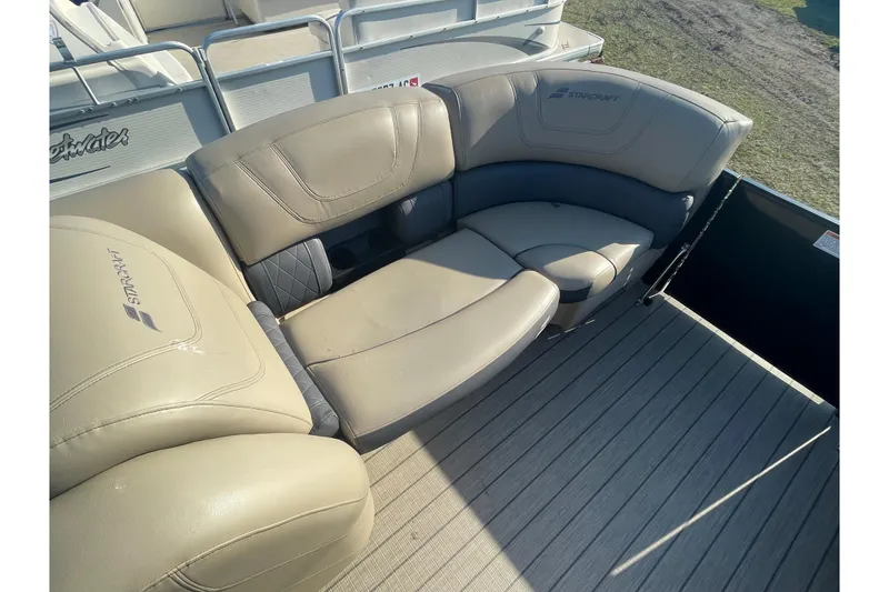 Slide: The Image of 2019 Starcraft SLS 3 boat with beige leather seating and wood-textured flooring. - 4