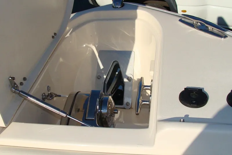 Slide: The Image of 2019 Grady-White Freedom 275 boat anchor compartment with winch and controls. - 26