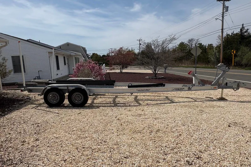 Slide: The Image of Boat trailer parked on gravel, suitable for 2019 Grady-White Freedom 275. - 30