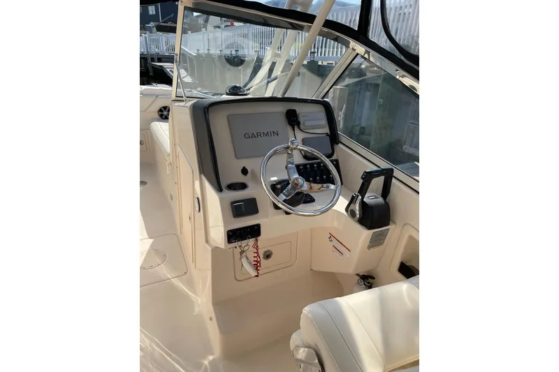 Slide: The Image of 2019 Grady-White Freedom 275 boat helm with Garmin navigation system. - 4