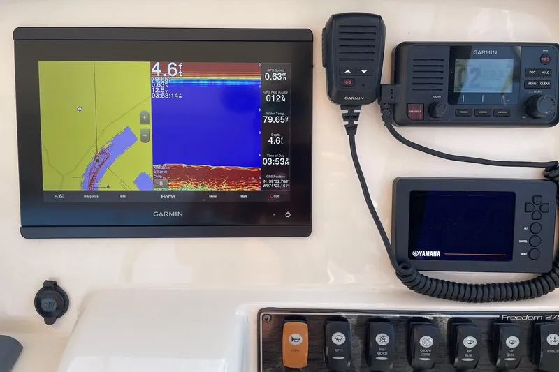 Slide: The Image of Garmin navigation system on 2019 Grady-White Freedom 275 boat dashboard. - 5