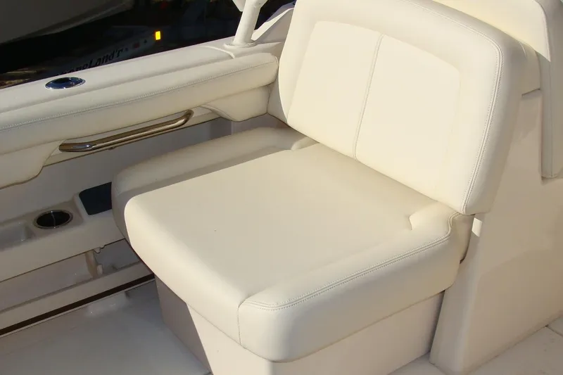Slide: The Image of Cream-colored seating on a 2019 Grady-White Freedom 275 boat. - 6