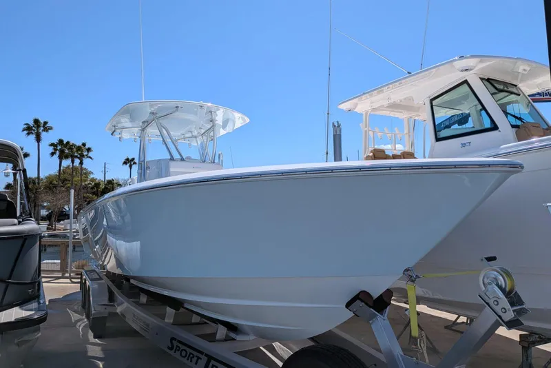 Slide: The Image of 2026 Contender 32 ST boat interior with white seating and spacious deck. - 16