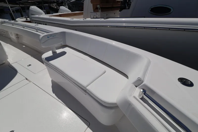 Slide: The Image of 2026 Contender 32 ST boat with sleek white seating and modern design. - 23
