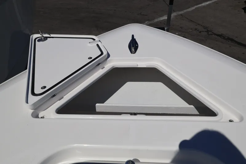 Slide: The Image of Bow storage compartment on 2026 Contender 32 ST boat, open hatch view. - 26