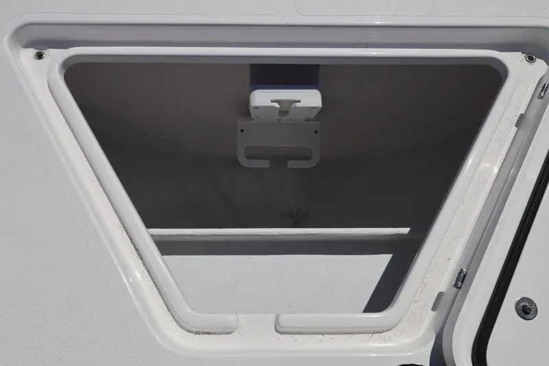 Slide: The Image of Storage compartment of 2026 Contender 32 ST boat, open and empty. - 27