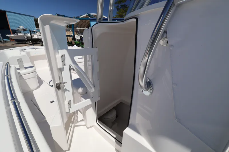 Slide: The Image of 2026 Contender 32 ST boat interior with open door and stainless steel handle. - 33
