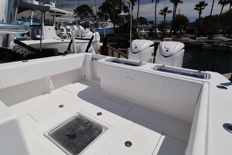 Slide: The Image of 2026 Contender 32 ST boat deck with Yamaha engines at marina. - 49