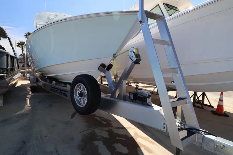 Slide: The Image of 2026 Contender 32 ST boat with logo and American flag decal. - 61