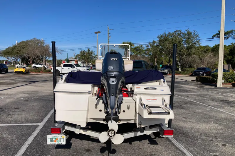 Slide: The Image of 2020 Robalo R160 Center Console boat with Yamaha outboard motor in parking lot. - 3