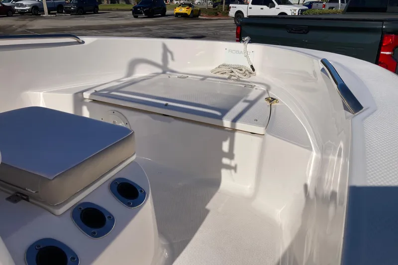 Slide: The Image of 2020 Robalo R160 Center Console boat interior with seating and storage. - 5