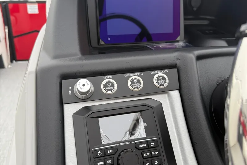 Slide: The Image of Control panel of 2026 Berkshire 23RFX STS boat with lighting and audio system. - 15