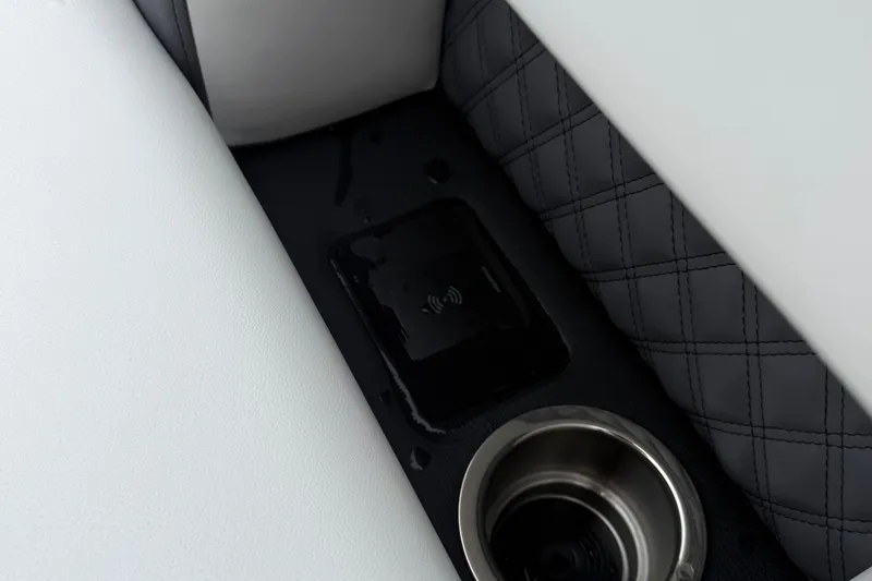 Slide: The Image of 2026 Berkshire 23RFX STS interior with wireless charging pad and cup holder. - 17
