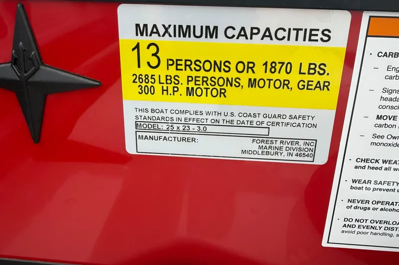 Slide: The Image of 2026 Berkshire 23RFX STS boat capacity label, 13 persons or 1870 lbs, 300 HP motor. - 19