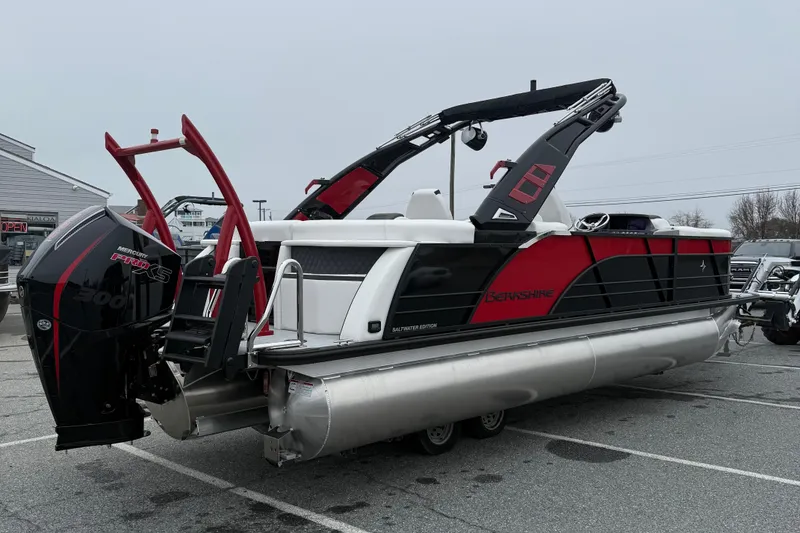 Slide: The Image of 2026 Berkshire 23RFX STS pontoon boat with Mercury Pro XS engine in parking lot. - 8