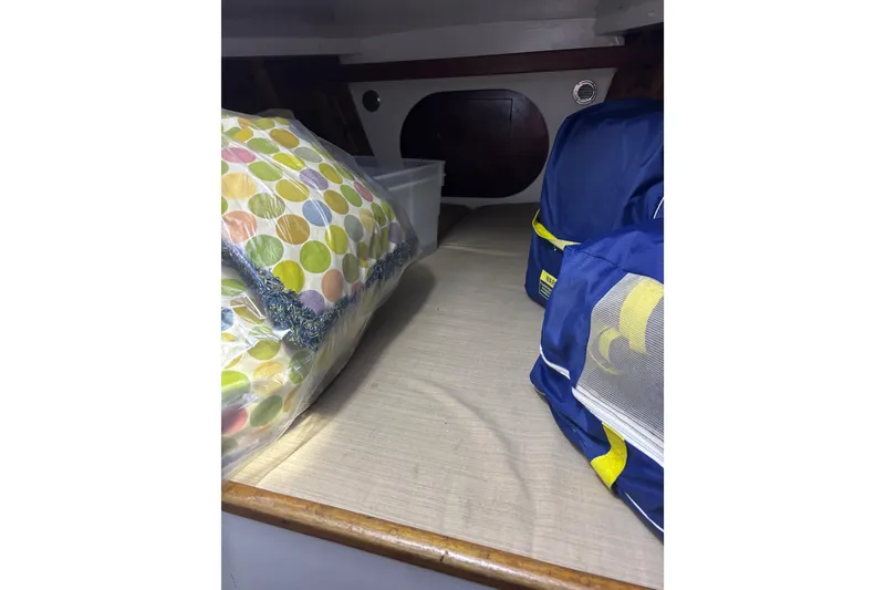 Slide: The Image of 1962 Kettenburg Sloop bathroom with toilet, countertop, and storage cabinets. - 12