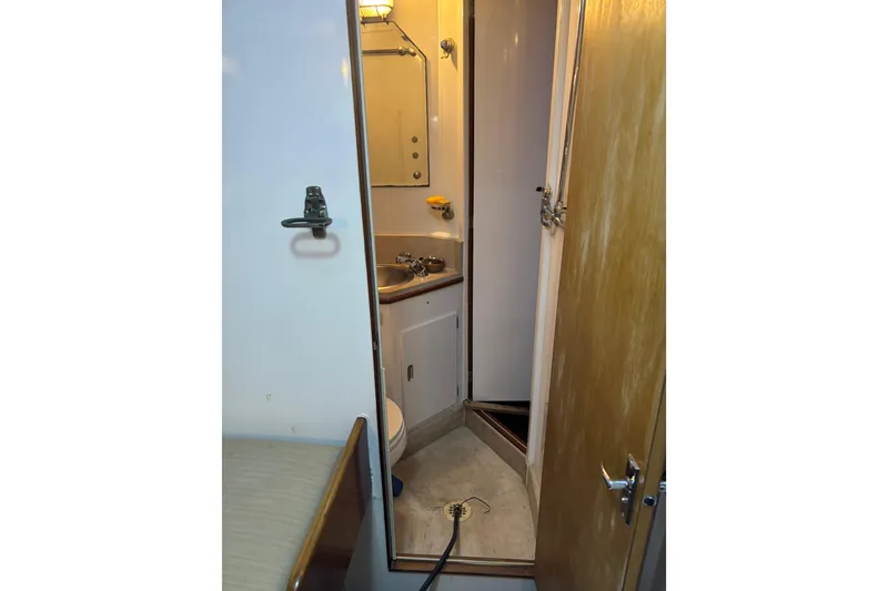 Slide: The Image of Engine of a 1962 Kettenburg Sloop, featuring various mechanical components and labels. - 14