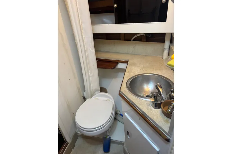 Slide: The Image of 1962 Kettenburg Sloop control panel with gauges and switches on wooden dashboard. - 15