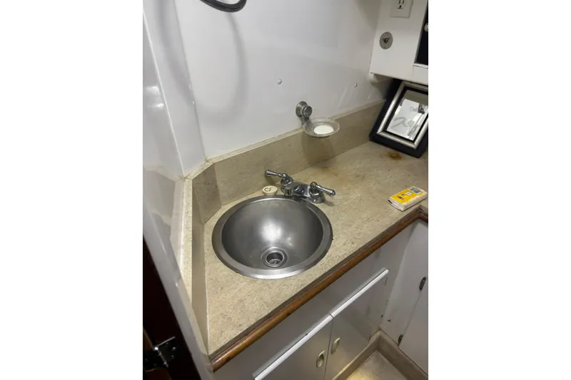 Slide: The Image of Raymarine navigation device on 1962 Kettenburg Sloop, mounted on wooden panel. - 16