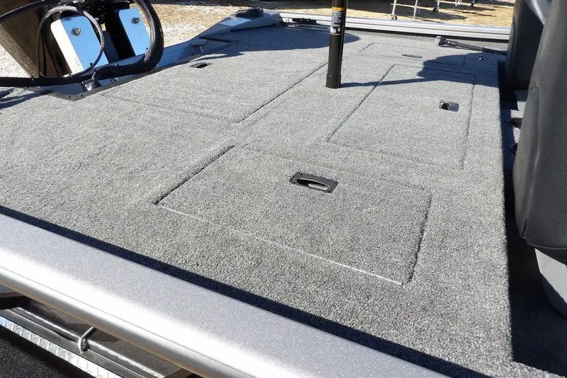 Slide: The Image of 2026 Crestliner XF 189 boat deck with storage compartments and steering wheel. - 11