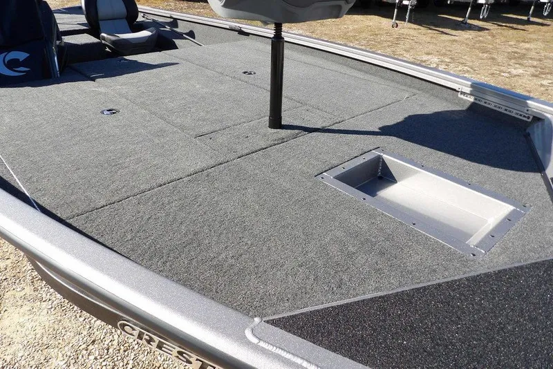 Slide: The Image of 2026 Crestliner XF 189 boat deck with seating and storage compartments. - 12