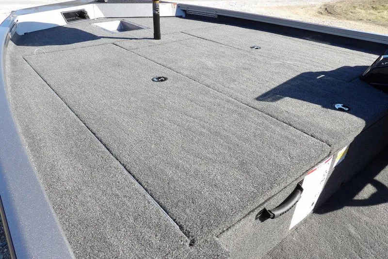 Slide: The Image of 2026 Crestliner XF 189 boat deck with gray carpeted surface and storage compartments. - 15