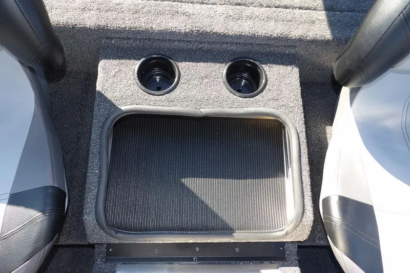 Slide: The Image of 2026 Crestliner XF 189 boat interior with cup holders and carpeted flooring. - 24